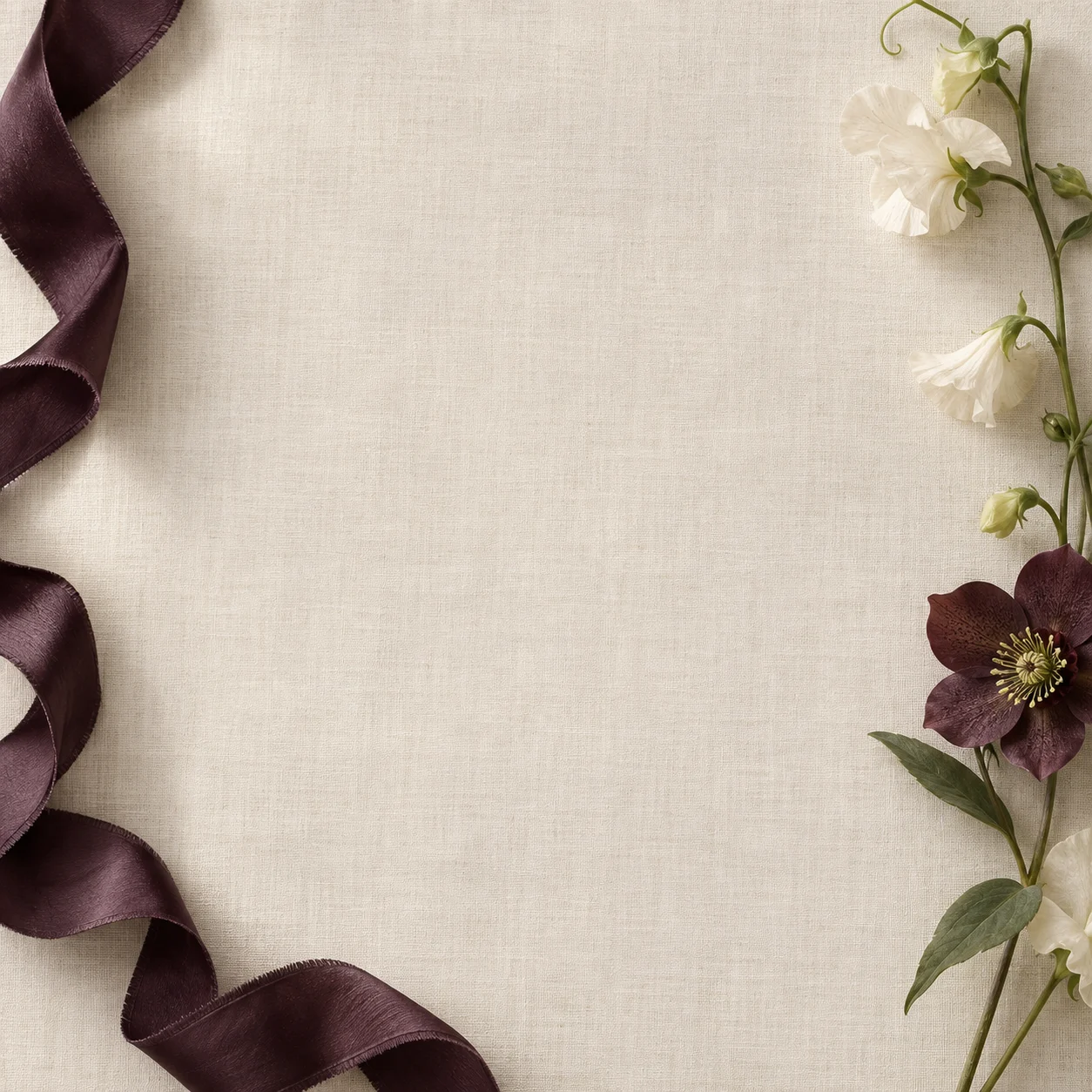 Sweet peas and a hellebore on linen, in black and white